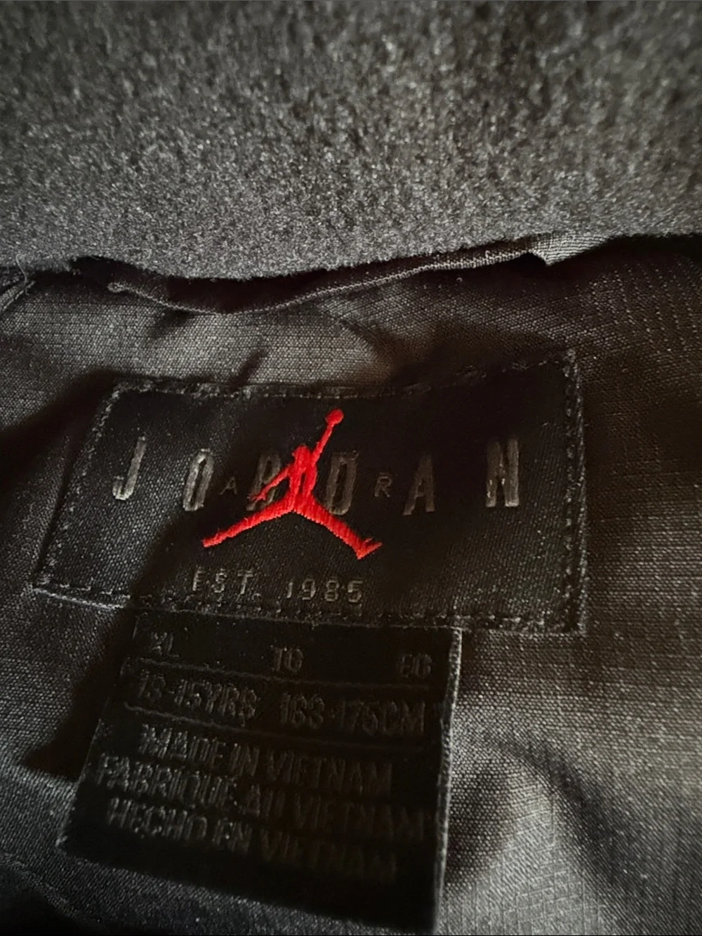 Jordan boys size xl Black Puffer Vest with White logo on front.